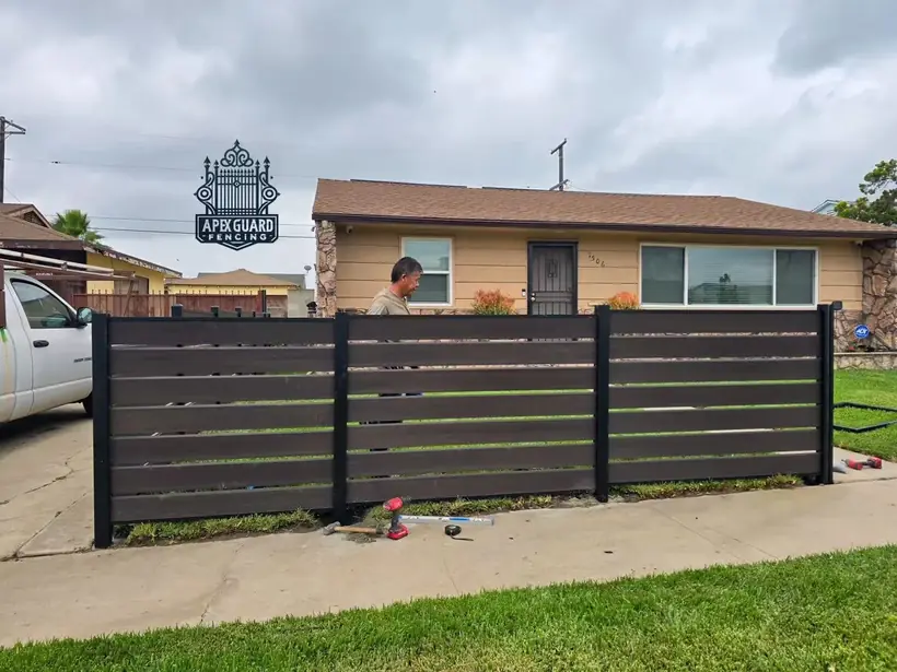 Composite (WPC) privacy fence and home by Apexguard Fence