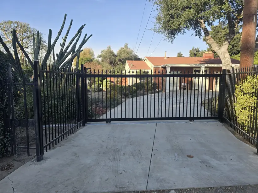 Wrought iron driveway gate by Apexguard Fence