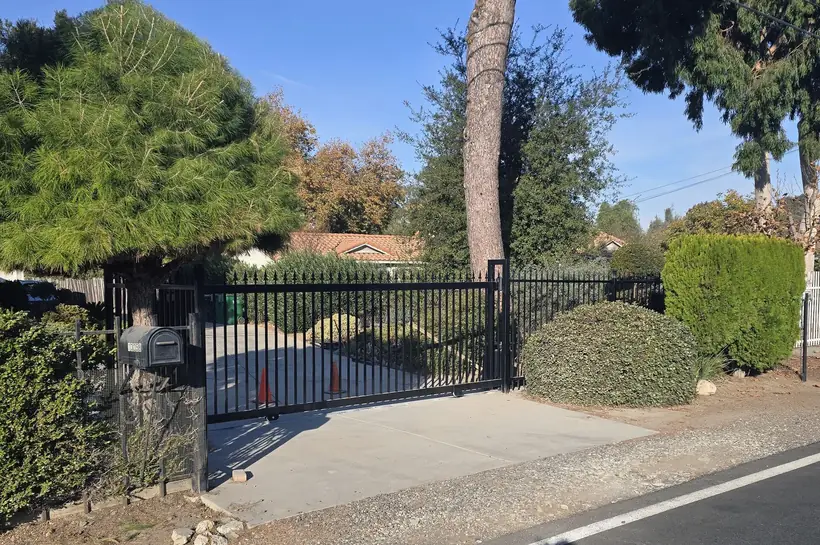 Wrought iron sliding entry gate by Apexguard Fence