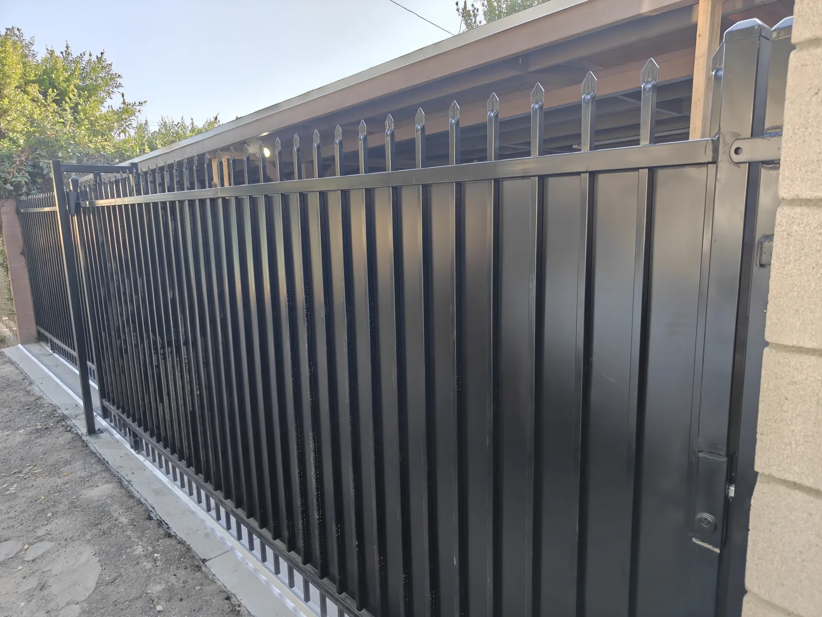 Galvanized powder-coated sliding gate with spear-top pickets in Los Angeles