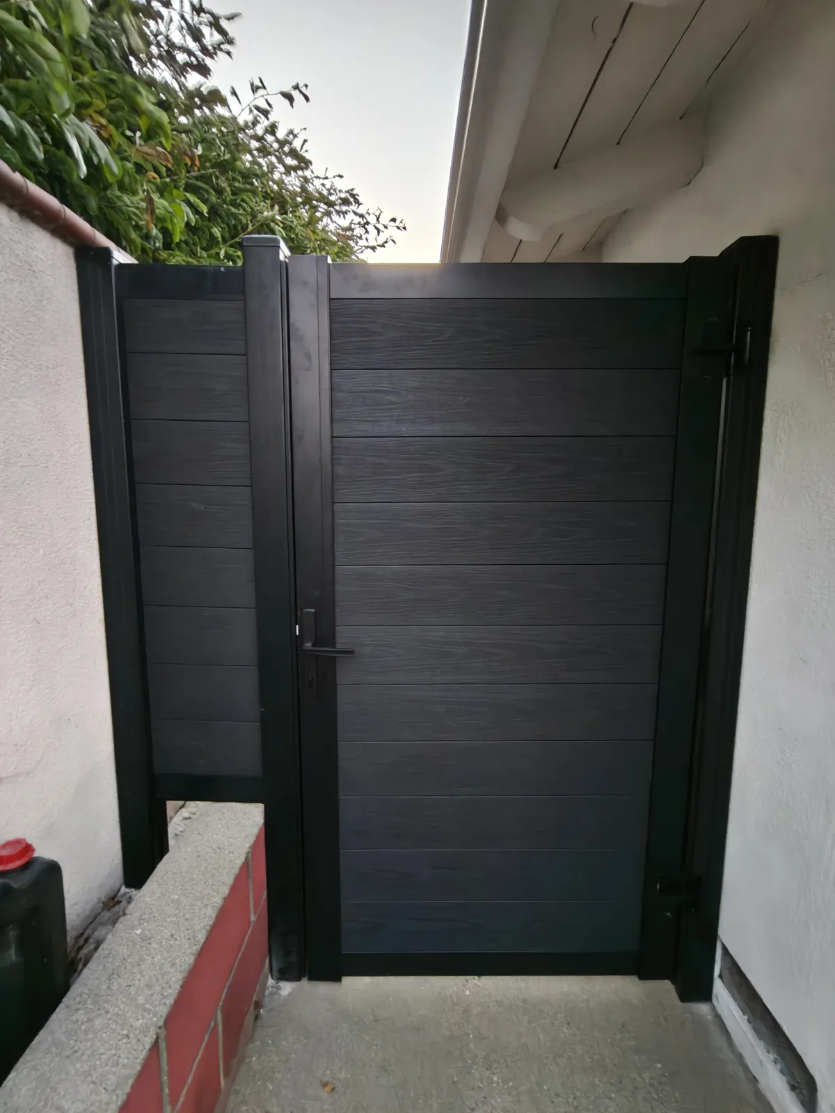 Composite WPC pedestrian gate with metal frame in Los Angeles by Apexguard Fence