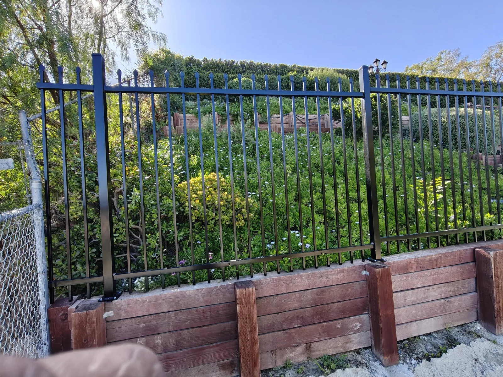 Tall wrought iron wildlife fence detail by Apexguard Fence — the build we install for Yorba Linda, CA hillside homes